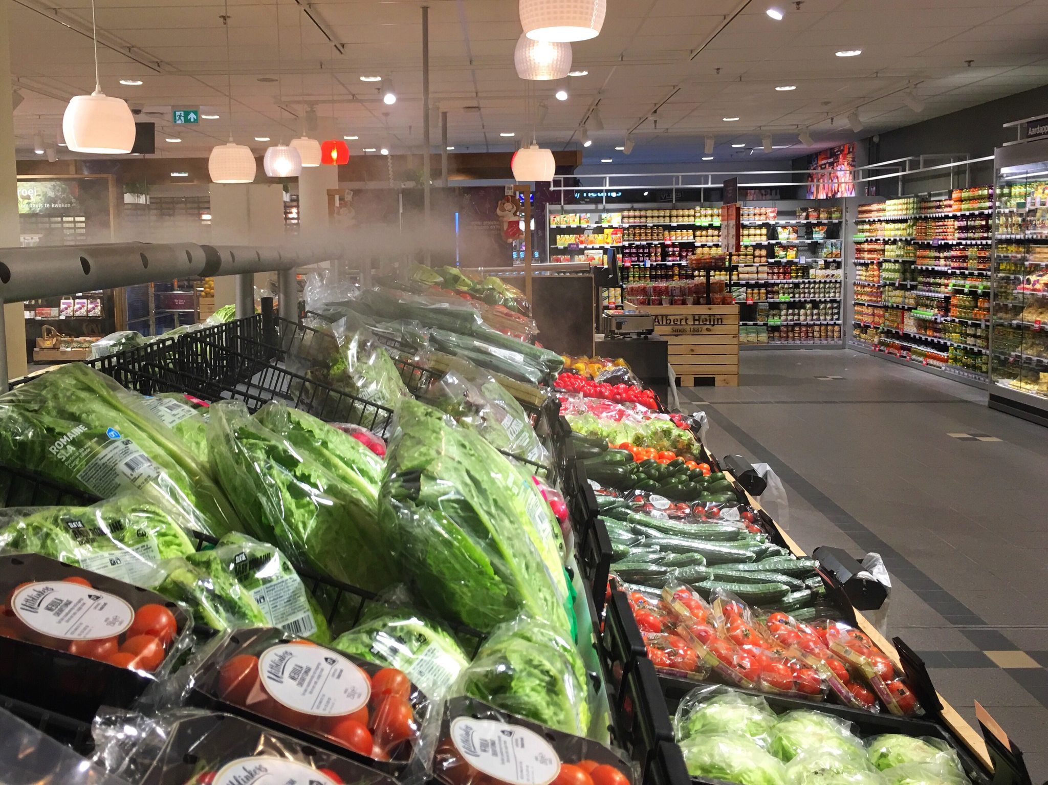 Fresh produce and carefully organised aisles in a supermarket