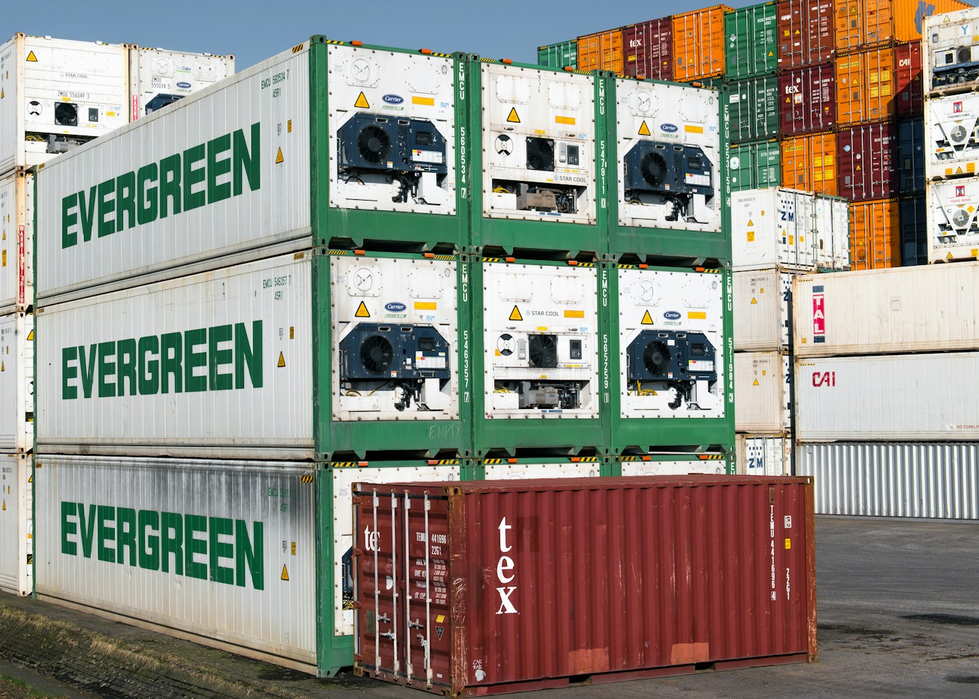 Shipping containers at a port representing international sourcing and logistics